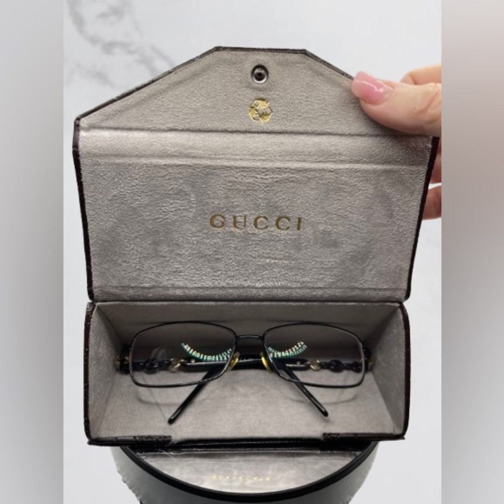 Genuine GUCCI prescription glasses with an eyeglass case.